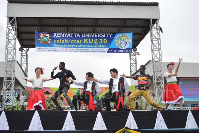 Comedians David and Karis trying some of the moves from the Gagnam style with the IYF dance troupe.