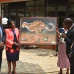 Hon Dr. Fred Matiang’i is awarded a gift of appreciation by VC professor mugenda